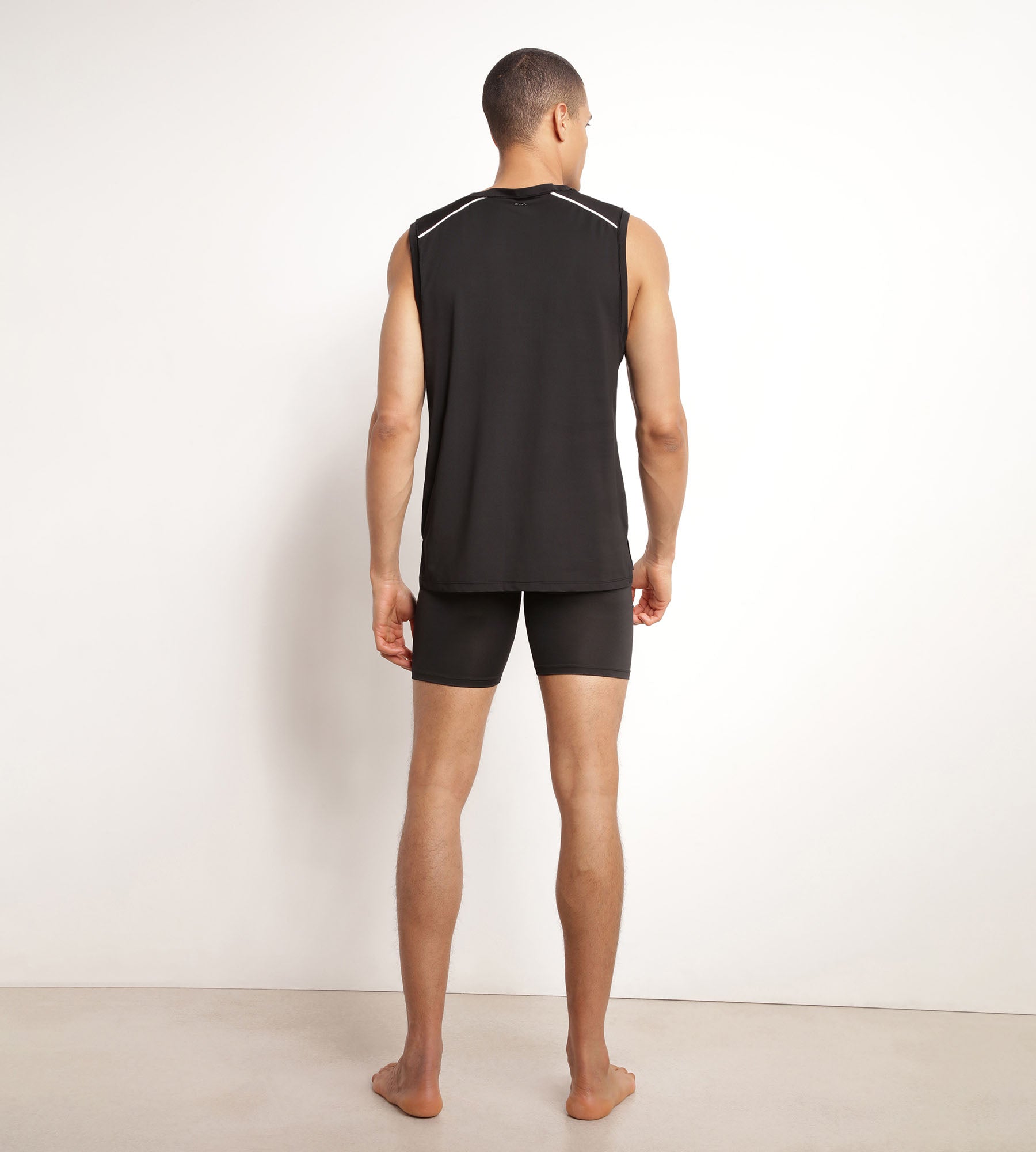 DIM Camiseta deportiva sin mangas para hombre en tejido vaporoso negro Dim Move