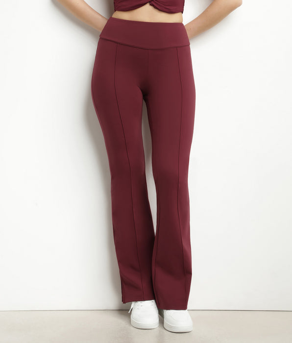 DIM Pantalón deportivo acampanado de mujer en punto suave burdeos Dim Move