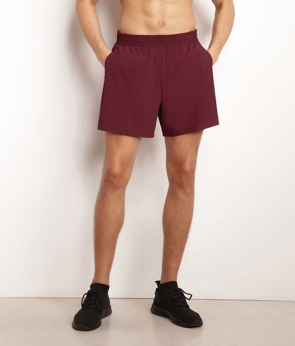 DIM Pantalón corto deportivo de hombre en tejido vaporoso burdeos Dim Move
